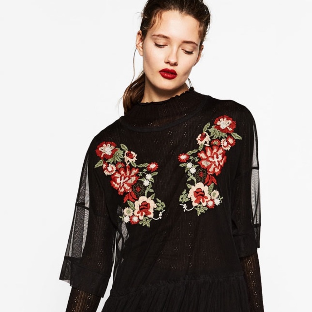 Sheer mesh peplum embroidered top